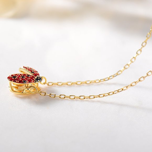 Swarovski's beating heart ladybug necklace pendant is exquisite and sparkles in - Picture 4 of 5